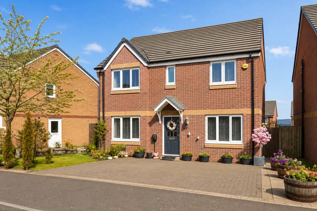 The attractive frontage and driveway parking help create a strong first impression at this modern detached home