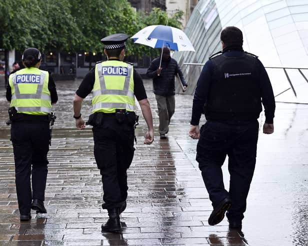 Police in St Enoch's Square, Glasgow, following violenct protests earlier this week