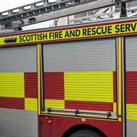 Public urged to avoid the area as fire crews remain on scene 12 hours after Woodlands Road fire
