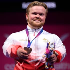 Gold medallist Mark Swan of England after his victory in the men's Para Powerlifting Lightweight event on day one of the Glasgow 2026 Commonwealth Games at SEC Armadillo.