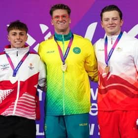 Sam Williamson, centre, took gold in the men's 100m breaststroke final.