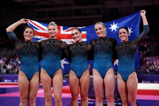 Gold medalists Georgia Godwin, Kate McDonald, Ruby Pass, Breanna Scott and Emily Whitehead of Team Australia celebrate after victory in the Women's Team Final
