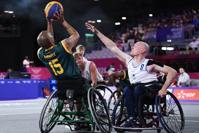 Simanga Mbhele of Team South Africa controls the ball whilst under pressure from Ross McConnell of Team Scotland during the 3x3 Basketball Men's Pool Round Pool B match