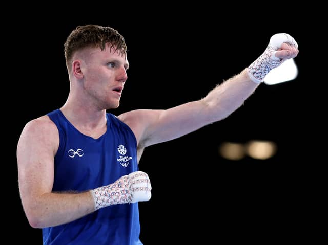 Nicholas Devlin of Team Scotland celebrates victory over Ebenezer Ankrah of Team Ghana during the Men's 60kg Round of 16 match