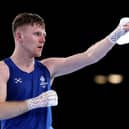 Nicholas Devlin of Team Scotland celebrates victory over Ebenezer Ankrah of Team Ghana during the Men's 60kg Round of 16 match