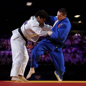 Remi Feuillet of Team Mauritius competes against Guillaume Gaulin of Team Canada during the Men -90 kg Final