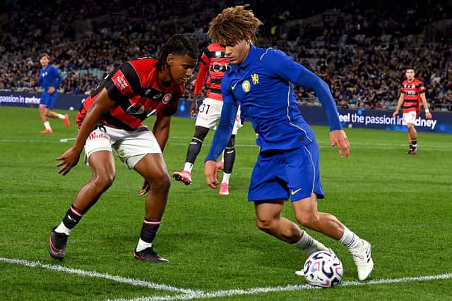 Wanderers's Panashe Madahna (L) fights for the ball with Chelsea's Landon Emenalo (R)
