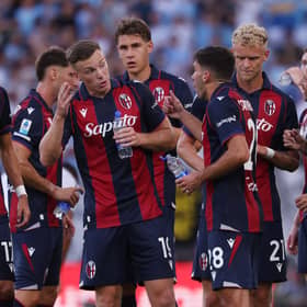 Lewis Ferguson in discussion with his team mates and head coach Domenico Tedesco during the defeat by Lazio in the Serie A opener at Stadio Renato Dall'Ara.
