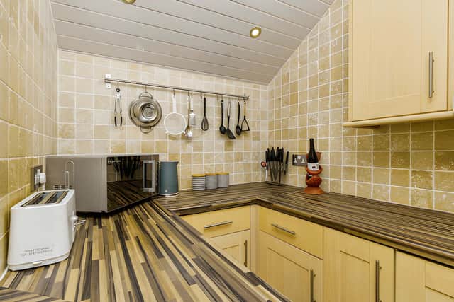 The dining kitchen forms one of two public rooms within this larger-style family property