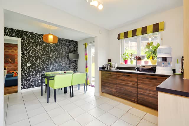 The modern fitted kitchen features a range of wall and base units within the spacious family home
