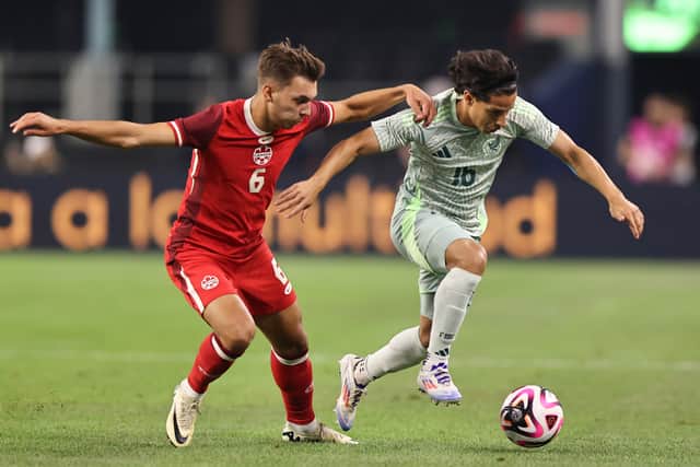 Celtic-linked midfielder Niko Sugur (L) in action for Canada during an international friendly match against Mexico