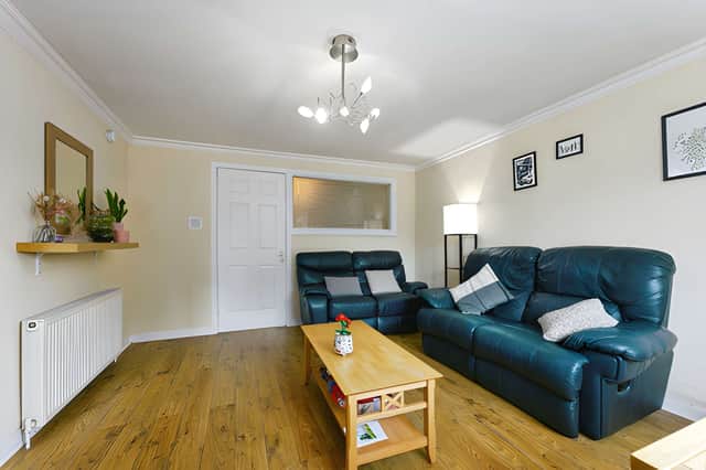 The attractive principal lounge forms the main reception space within this welcoming ground-floor home