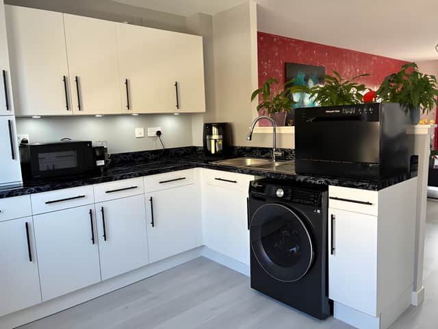 The well-appointed kitchen forms part of the home's generous open-plan living and dining space