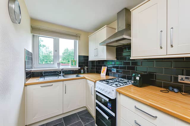 A contemporary refitted kitchen brings modern style and practical storage to the home's interior