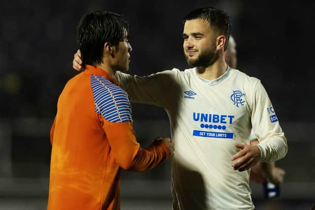 Rangers midfielder Nicolas Raskin and forward Minsu Kim at full-time after the 2-1 win over Falkirk. (Photo by Craig Foy / SNS Group)