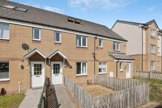 The Investment Way mid-terrace villa has open aspects to the front and residents parking