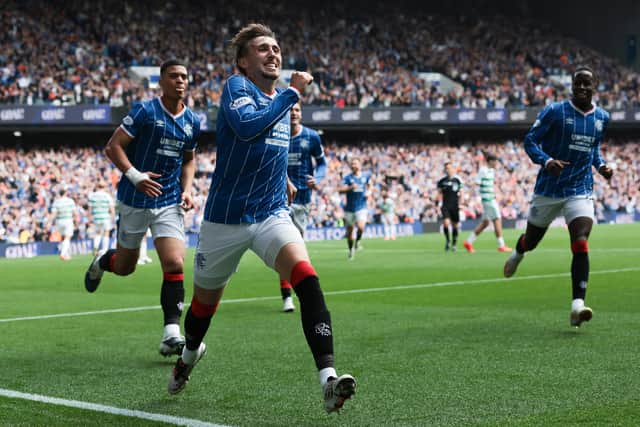 Dan Neil of Rangers celebrates scoring his team's opening goal against Celtic