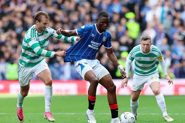 Olwethu Makhanya of Rangers is challenged by Benjamin Nygren of Celtic during the Premier Sports Cup Quarter Final match between Rangers and Celtic at Ibrox