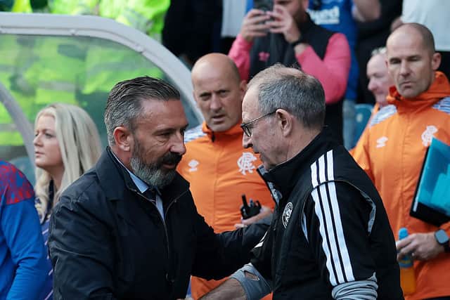 Derek McInnes, Manager of Rangers, shakes hands with Martin O'Neill, Manager of Celtic