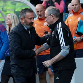 Derek McInnes, Manager of Rangers, shakes hands with Martin O'Neill, Manager of Celtic