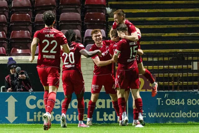 Aberdeen's Connor Ronan celebrates scoring to make it 2-0 with teammates during a William Hill Premiership match between Motherwell and Aberdeen at Fir Park