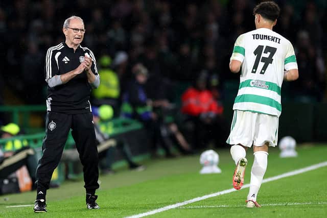 Martin O'Neill, Manager of Celtic interacts with Sebastian Tounekti