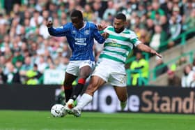 Djiedi Gassama of Rangers vies with Cameron Carter-Vickers of Celtic