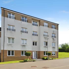 The Palmer Court development provides a modern setting for this ground floor Bishopbriggs flat