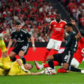 Jhon Duran of SL Benfica shoots under pressure from Auston Trusty of Celtic 
