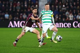 Claudio Braga of Hearts and Callum McGregor of Celtic tussle for possession during a Premiership clash in January 2026