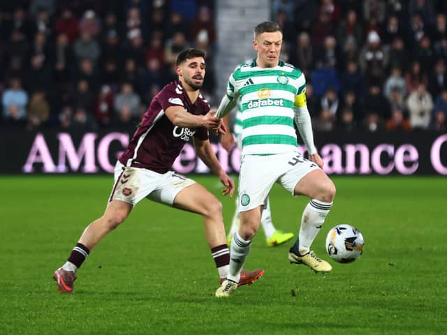Claudio Braga of Hearts and Callum McGregor of Celtic tussle for possession during a Premiership clash in January 2026