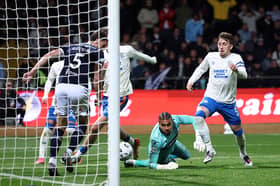 Owen Bevan of Dundee clears the ball during the William Hill Premiership 2026/27 match between Dundee and Glasgow Rangers at Dens Park Stadium