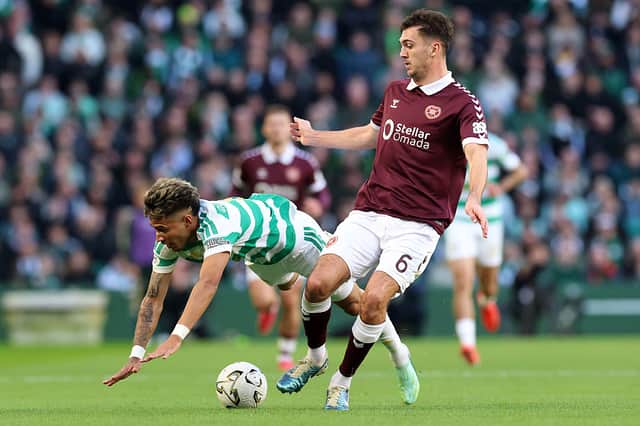 Camilo Duran of Celtic is challenged by Oisin McEntee of Heart of Midlothian