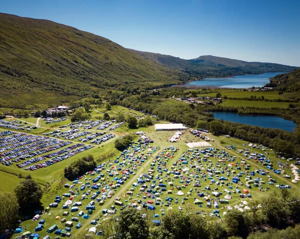 An aerial shot from 2022 shows how much the festival has grown as well as its stunning location.