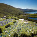 An aerial shot from 2022 shows how much the festival has grown as well as its stunning location.