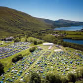An aerial shot from 2022 shows how much the festival has grown as well as its stunning location.