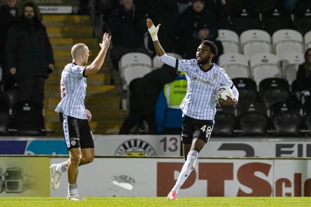 St Mirren's Paul Nsio (R) celebrates scoring to make it 1-1 with teammate Alex Gogic against Hibs