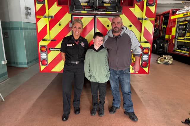(L-R) Watch Commander Rhonda Jones, Riley Luke, Scott Luke