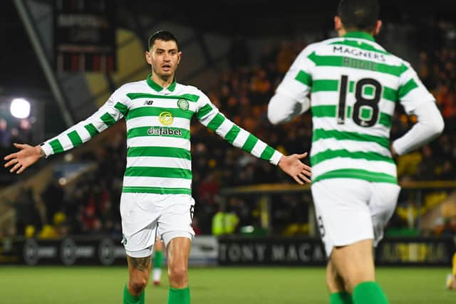 Celtic's Nir Bitton celebrates with Tom Rogic after his injury-time equaliser against Livingston. Picture: Craig Foy / SNS