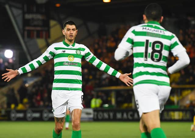 Celtic's Nir Bitton celebrates with Tom Rogic after his injury-time equaliser against Livingston. Picture: Craig Foy / SNS