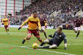 Hearts keeper Bobby Zlamal challenges Motherwell's Jermaine Hylton (Pic by Ian McFadyen)