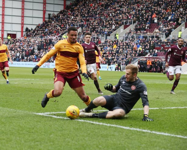 Hearts keeper Bobby Zlamal challenges Motherwell's Jermaine Hylton (Pic by Ian McFadyen)