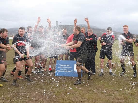 The champagne is flowing as Biggar celebrate fantastic title win (Pic by Nigel Pacey)