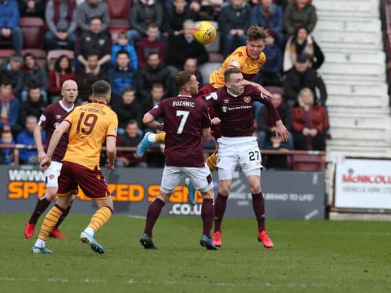 Mark OHara wins a header during Wells last game, a 1-1 draw at Hearts on March 7 (Pic by Ian McFadyen)