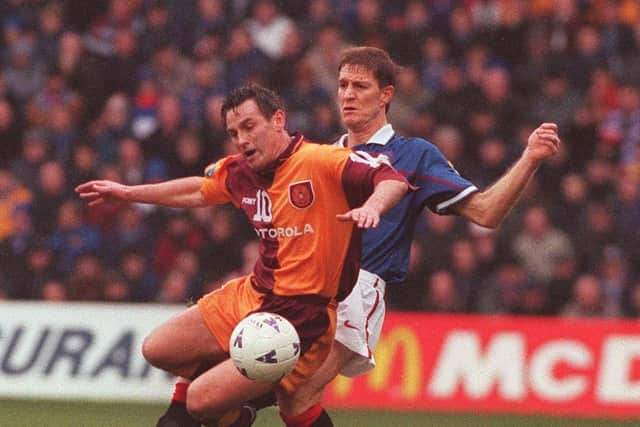 Dougie Arnott battles against Rangers defender Richard Gough