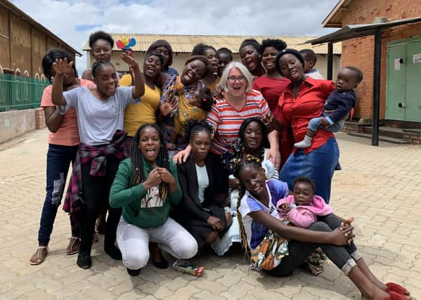 Building a better future...most of the young mums are still children themselves so the Guild members, including Karen Gillon pictured here with the girls, enjoyed seeing them relax and have some fun too.