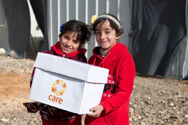 While its aid services have changed much in the last 75 years, CARE continues to send packages which are much appreciated by recipients like these very grateful young refugees.