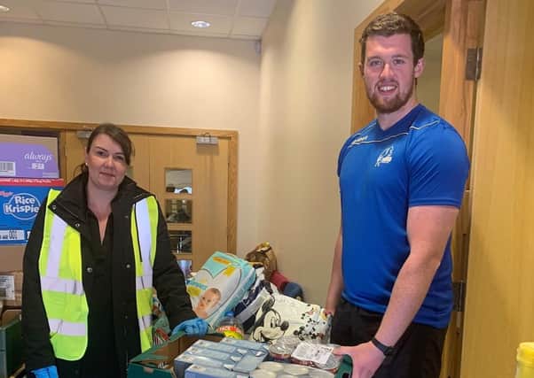 Cumbernauld Colts are helping out their local community during the coronavirus lockdown. Pictured are Fiona Warnock and Chris McLaughlin