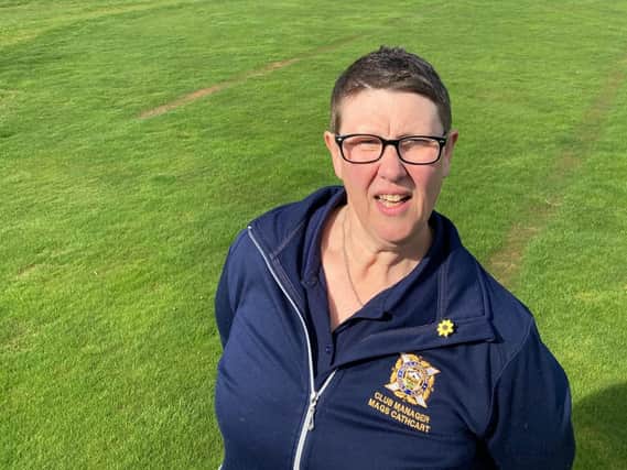 Mags Cathcart, standing on a rutted 18th green at Hollandbush GC, is worried all six South Lanarkshire Council courses face closure without immediate action.