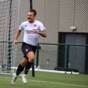 Ally Love celebrates after scoring for Clyde from the penalty spot against Annan to clinch promotion